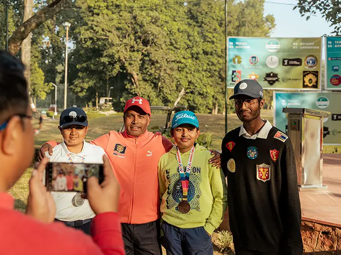 Golf coaches in Dehradun training a young golfer